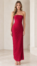Front view of model wearing strapless red ruched corset column maxi dress