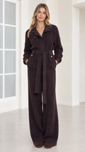 Front view of woman wearing dark brown ribbed knit belted jacket and wide-leg pants set