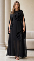 Full front view of black floral flocked chiffon cape sleeve maxi dress
