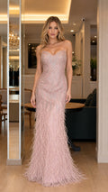 Front view of pink feathered evening gown