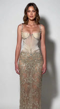 Front view of model wearing champagne embellished corset maxi evening gown