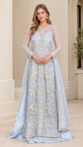 Front view of model wearing a light blue embroidered long sleeve formal evening gown with beaded hem