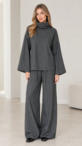 Front view of woman wearing Charcoal Grey pinstripe turtleneck top and wide-leg pants set