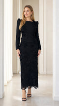 Front view of model wearing black beaded floral lace long sleeve column evening dress