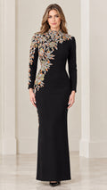 Front view of black long sleeve evening gown with asymmetrical floral embroidery