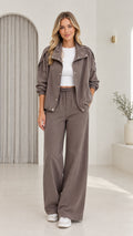 Front view of model wearing taupe utility jacket and wide-leg pants set
