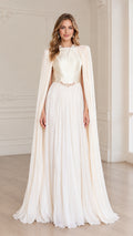 Front full view of woman wearing ivory pleated cape evening gown