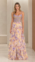 Front view of woman wearing pastel yellow floral chiffon maxi dress with beaded butterfly bodice