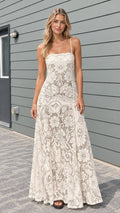 Model wearing cream floral lace cami maxi dress front view