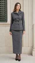 Front view of woman wearing Heather Grey double-breasted tweed blazer and maxi skirt set