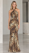 Front view of model wearing Bronze Gold halter neck shimmer animal print maxi gown