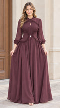 Front full-length view of woman wearing burgundy pleated mock neck chiffon maxi dress