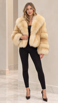 Front full view of woman wearing Champagne Beige cropped faux fur jacket with black pants and heels