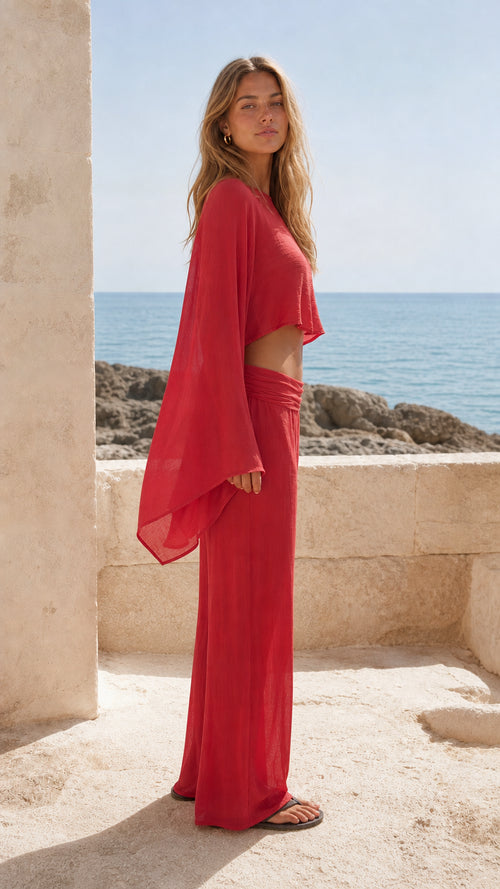 Side view of woman in red two-piece resort set