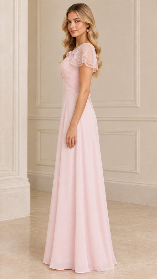 Side profile view of blush pink formal capelet maxi dress