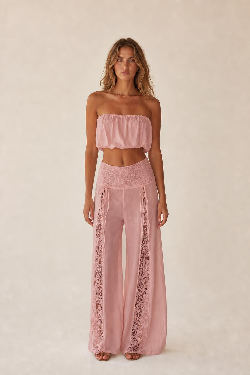 Front view of the pink color variant two-piece set